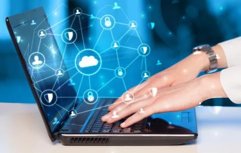 Hand using laptop with centralized linked cloud system concept Stock Photos