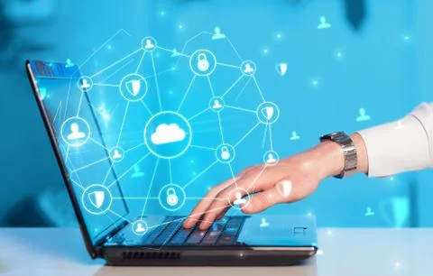Hand using laptop with centralized linked cloud system concept Stock Photos