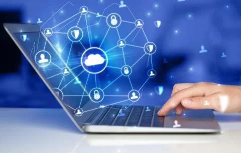 Hand using laptop with centralized linked cloud system concept Stock Photos