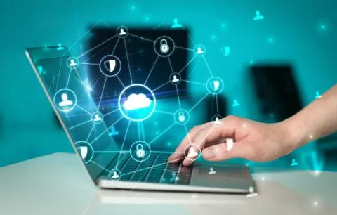 Hand using laptop with centralized linked cloud system concept Stock Photos