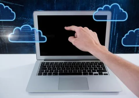 Hand using laptop with cloud icons and technology background Stock Photos