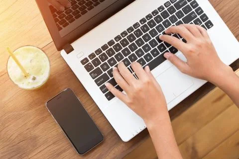 Hand using laptop computer on top angle view Stock Photos