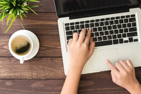 Hand using laptop computer on top view Stock Photos