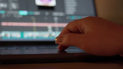 Hand Using Laptop Touchpad While Editing Video Stock Footage 344946102
