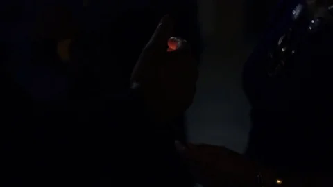 Hand using a lighter in the dark Stock Footage 78109730