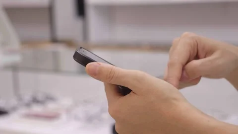 Hand using mobile phone, hand holding phone Stock Footage 242889635
