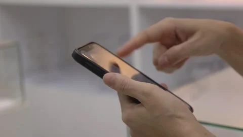 Hand using mobile phone, hand holding phone Stock Footage 242889712