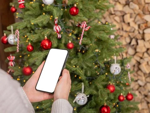 Hand using mobile phone screen mockup, smartphone display mock up on winter Stock Photos