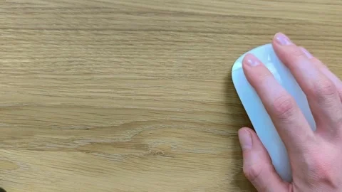 Hand using a mouse with empty space for text overlay. Wooden background sur.. Stock Footage 340283884