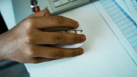 Hand Using Mouse with Laptop and Documents, Close-up of a hand using a comp.. 動画素材 304977967