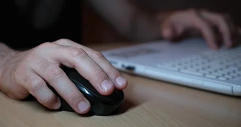 Hand Using Mouse While Working on Laptop, Close-Up of Computer Workspace Stock Footage 328103478