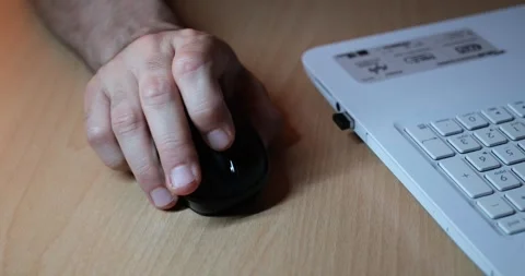 Hand Using Mouse While Working on Laptop, Close-Up of Computer Workspace Stock Footage 328103696