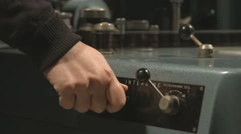 Hand using old film editing equipment Stock Footage 61798713