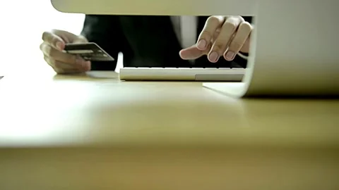 Hand using pc computer and credit card and doing online shopping at home Mode Stock Footage 265930213