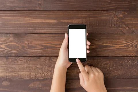 Hand using phone blank screen on top view angle Stock Photos