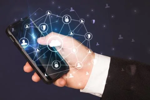 Hand using phone with centralized linked cloud system concept Stock Photos