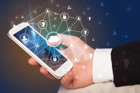 Hand using phone with centralized linked cloud system concept Stock Photos