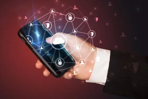 Hand using phone with centralized linked cloud system concept Stock Photos