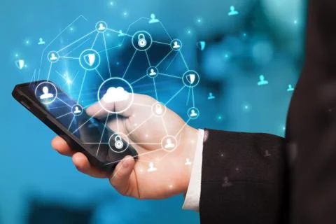Hand using phone with centralized linked cloud system concept Stock Photos