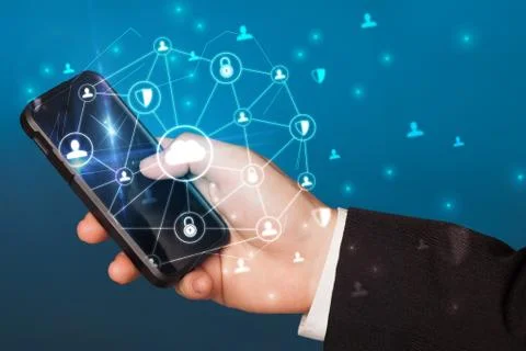 Hand using phone with centralized linked cloud system concept Stock Photos