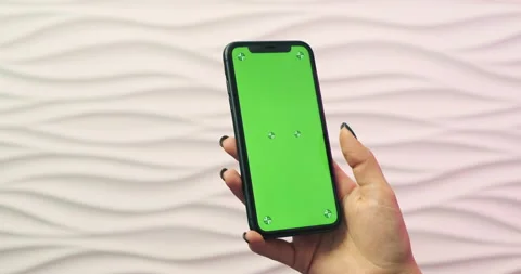 Hand using Phone green screen chroma key mockup on white restaurant background Stock Footage 149894142