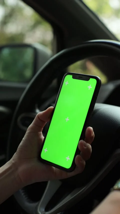 Hand using phone green screen in car Stock Footage 271486520