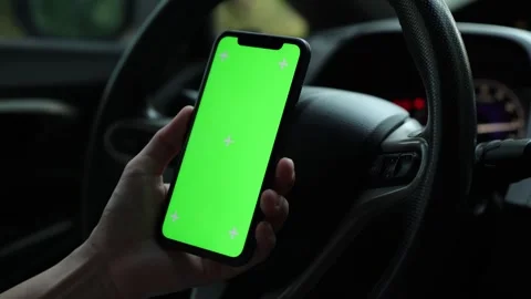 Hand using phone green screen in car Stock Footage 271486521