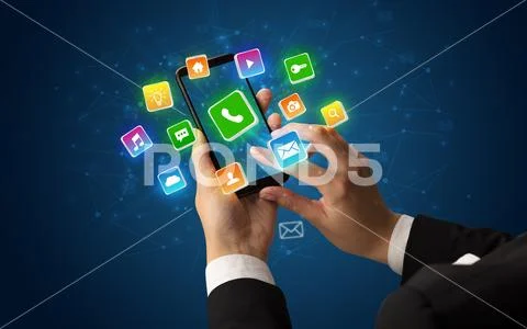 Hand using phone with shiny application icons Stock Photos