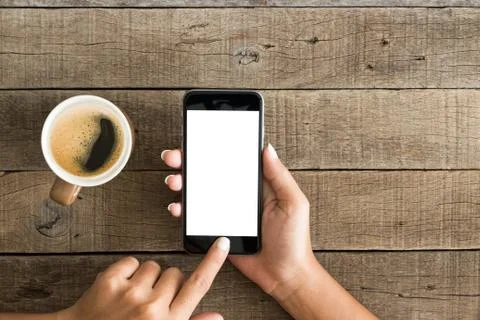 Hand using phone white screen on top view Foto stock