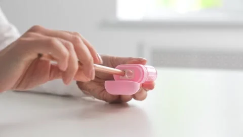 Hand using pink pencil sharpener at desk Stock Footage 324815973