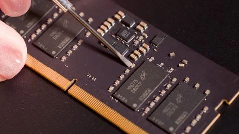 Hand Using Precision Tool to Inspect Computer Memory Module Stock Footage 320045310