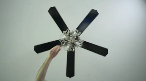 Hand using the pull cord to turn a Ceiling fan light on Stock Footage 63213646