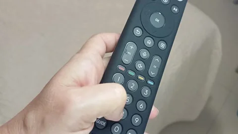 Hand using a remote control, Marina di Carrara, Italy, October 6 2026 Stock-Footage 347157409