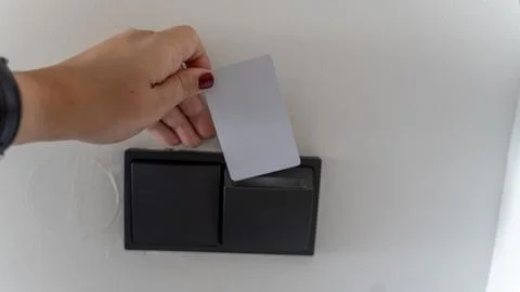 Hand Using RFID Key Card to Unlock Electronic Door Access System Stock Photos