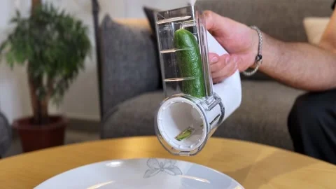Hand Using Rotary Vegetable Slicer Cutting Cucumber Stock Footage 335199384