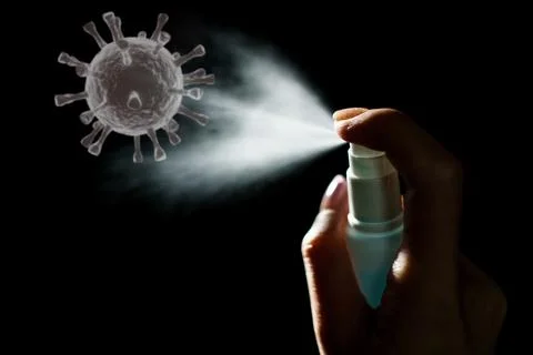 Hand using sanitizer spray, alcohol spraying disinfectant to stop spreading.. Stock Photos