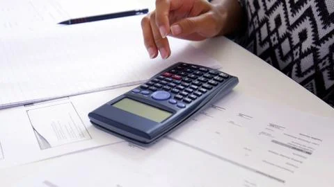 Hand using scientific calculator. Stock Photos