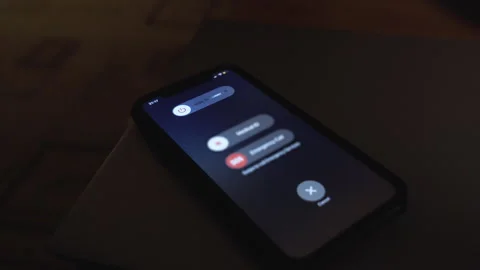 Hand using is sliding to turn off the mobile phone to reduce power consumption Video stock 258335835