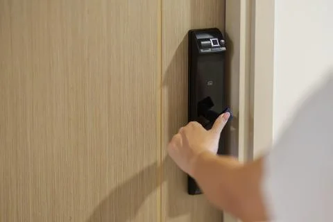 Hand using smart digital door lock while open or close the door at home or .. 스톡 사진