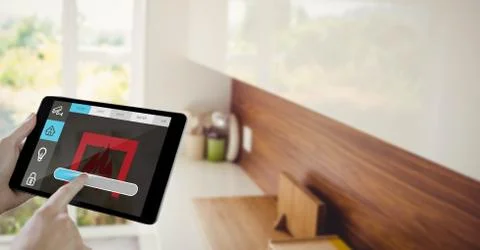 Hand using smart home application on tablet computer 스톡 사진