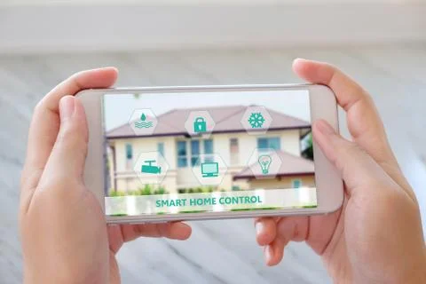 Hand using smart phone as smart home control application, smart home concept, Stock Photos