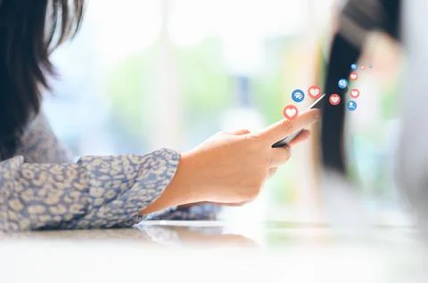 Hand using smart phone with Social media concept Stock Photos