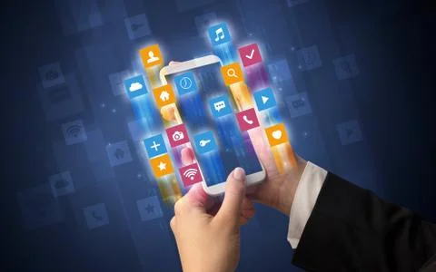 Hand using smartphone with angular app icons Foto stock