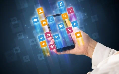 Hand using smartphone with angular app icons Foto stock