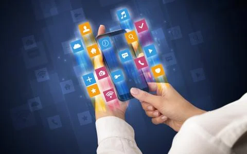 Hand using smartphone with angular app icons Stock Photos