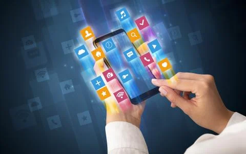 Hand using smartphone with angular app icons Fotos de archivo