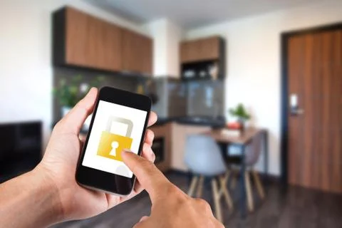 Hand using smartphone by app smart home on mobile for remote control everythi Stock Photos