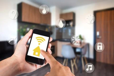 Hand using smartphone by app smart home on mobile for remote control everythi Stock Photos
