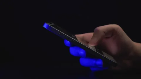 Hand Using Smartphone with Blue Light Stock Footage 277195931