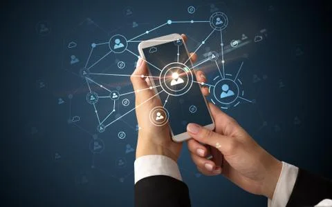 Hand using smartphone to connect people concept Stock Photos
